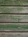 Background of shabby horizontal boards painted with green paint. Fragment of wooden shutters of an old house in Herceg Royalty Free Stock Photo