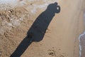 Background with the shadow of a man on the sand