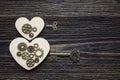 Background with shape of hearts, the gear mechanism and a key on Royalty Free Stock Photo