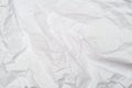 A background of sheet of white crumpled paper with wrinkles, backdrop for design and web Royalty Free Stock Photo