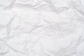 A background of sheet of white crumpled paper with wrinkles, backdrop for design and web Royalty Free Stock Photo