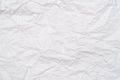 A background of sheet of white crumpled paper with wrinkles, backdrop for design and web Royalty Free Stock Photo