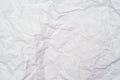 A background of sheet of white crumpled paper with wrinkles, backdrop for design and web Royalty Free Stock Photo