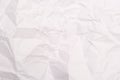 A background of sheet of white crumpled paper with wrinkles, backdrop for design and web Royalty Free Stock Photo