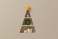 Background shelf christmas tree shape with gift box and decorate element on luxury gold background