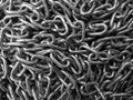 Background of shiny metal chains. Links are randomly. Top view. Close up. Black and white image. Royalty Free Stock Photo