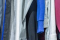 Collection of colored shirts on hangers Royalty Free Stock Photo