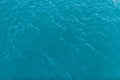 Background shot of aqua sea water surface. Sea surface aerial view. Waving water surface of the sea background