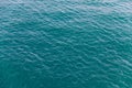 Background shot of aqua sea water surface. Sea surface aerial view. Waving water surface of the sea background