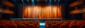background showcasing a school auditorium with a stage, curtains, and seats filled for a performance. Royalty Free Stock Photo