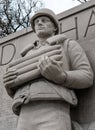 Fine sculpture of a fallen US Navy sailor seen holding a magazine clip.