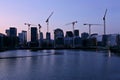 Background of silhouette skyscrapers and cranes under construction. Royalty Free Stock Photo