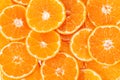 Background of slices of clementine fruit, close up