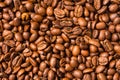 Background of small brown coffee beans.