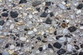 Background of small pebbles in a concrete wall