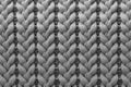 Background of soft gray knitted fabric, texture in an upright position of a wool sweater close-up , wallpaper concept, wrapping Royalty Free Stock Photo