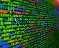 Background of software developer script. Abstract source code background. Hi-tech modern screen of data, digits and chars on Royalty Free Stock Photo
