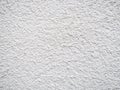 Background from solid material. Pimply white wall. Uneven wall surface Royalty Free Stock Photo