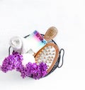 Background Spa composition for body care on a light wooden background with lilac flowers Royalty Free Stock Photo