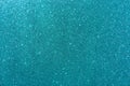 Background with sparkles. Backdrop with glitter. Shiny textured surface. Dark cyan