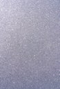 Background with sparkles. Backdrop with glitter. Shiny textured surface. Vertical image. Dark grayish blue Royalty Free Stock Photo