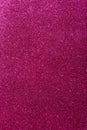 Background with sparkles. Backdrop with glitter. Shiny textured surface. Vertical image. Dark pink Royalty Free Stock Photo