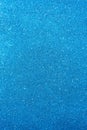 Background with sparkles. Backdrop with glitter. Shiny textured surface. Vertical image. Strong blue Royalty Free Stock Photo