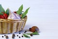 Background and spices. The bay leaf in a wicker basket, garlic a