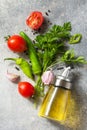 Background spices, herbs and greens. Selection of spices, herbs and olive oil on a stone table. Royalty Free Stock Photo