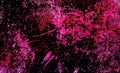 Background with splashed and spots of pink paint on dark background. Royalty Free Stock Photo