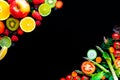 Background with spring and summer fruits and vegetables on black table Royalty Free Stock Photo