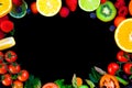 Circular background with spring and summer colorful fruits and vegetables on black table from above with large copy space Royalty Free Stock Photo