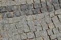 Background square gray granite stones lined the path on the pavement