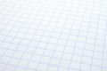 Background of squared notebook sheet. Grid paper copybook. Light white background on the topic of school, study and learning.
