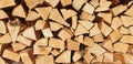 Panorama of stacked chopped firewood. Royalty Free Stock Photo