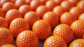 Background of Stacked Orange Golf Balls. Sport. Full Frame. Royalty Free Stock Photo