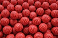 Background of Stacked Orange Golf Balls. Sport. Full Frame. Close-up Royalty Free Stock Photo