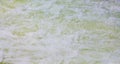 Background of stormy stream of fresh water with foam_