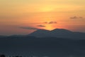 Background with sun on the mountains at twilight