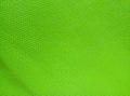 The background surface of the bright green canvas fabric Royalty Free Stock Photo