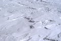 Background - surface of firn field on the slope of the mountain