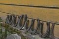 Background surface of very old and rusty horseshoes placed near the wall Royalty Free Stock Photo