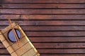 Background for sushi. Bamboo mat, soy sauce, chopsticks on wooden table. Top view and copy space Royalty Free Stock Photo