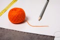 Background for tailor orange thread ribbon and pencil Royalty Free Stock Photo