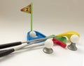 Background about teaching the game of Golf with toy Golf clubs a Royalty Free Stock Photo