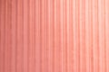 Background texture gradations on pink plastic