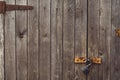 Background texture. Aged wood doors with rusty metal rivets and barn lock. Copy space Royalty Free Stock Photo