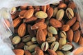 Background texture of assorted mixed nuts including almonds and pistachio Royalty Free Stock Photo