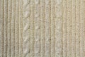 Background texture of beige pattern knitted fabric made of cotton or wool closeup Royalty Free Stock Photo