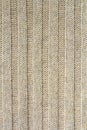 Background texture of beige pattern knitted fabric made of cotton or wool closeup Royalty Free Stock Photo